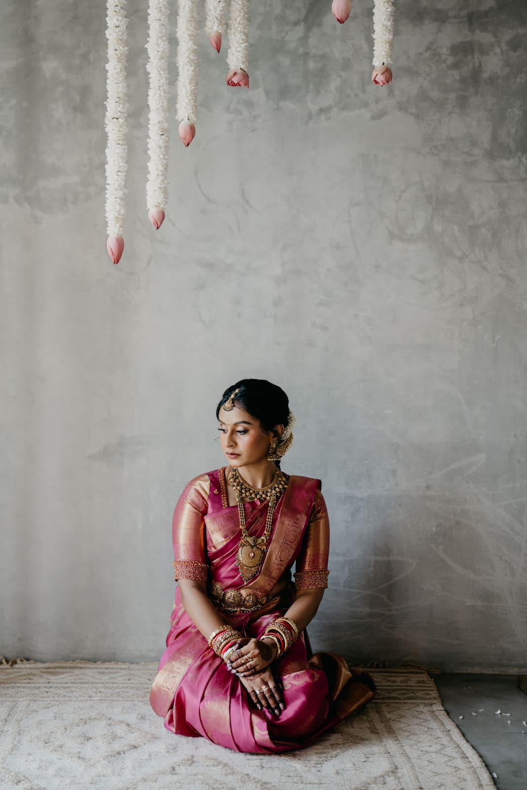 Harshitha seated for her bridal portrait
